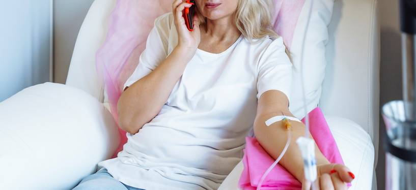 nurse injecting IV to the patient